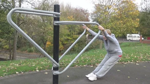 An old lady doing stretches in a park Video stock 85601635