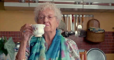 Old lady drinking tea, pensive Stock Footage 81357432