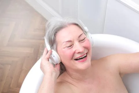 Old lady having a bath Stock Photos