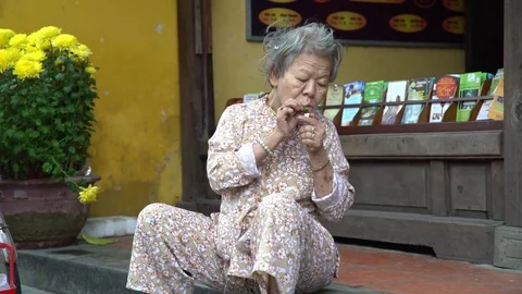 Old Lady Having a Smoke Stock Footage