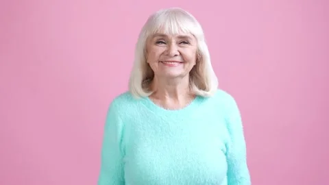 Old lady interested thoughts isolated pastel color background Video stock 169287728