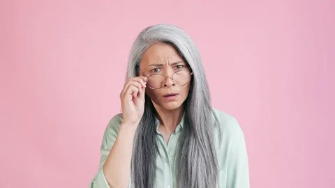 Old lady look specs criticize youngster idea isolated pastel color background Stock Footage 165348201