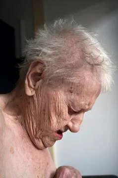 Old lady looking down Stock Photos