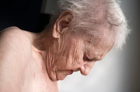 Old lady looking down Stock Photos