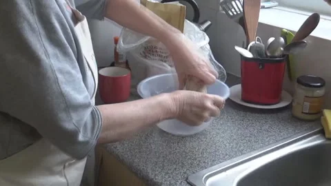 Old lady makes dough Stock Footage 87740062