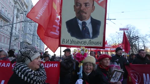 An old lady participates in a march marking the Great Socialist Revolution Vídeo Stock 148449686