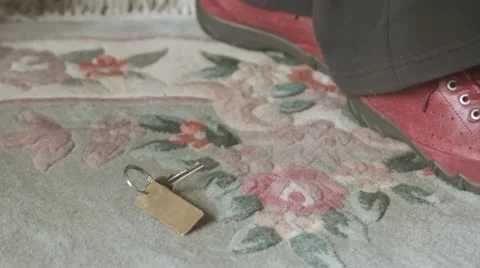 Old lady picking up keys Video stock 12661601