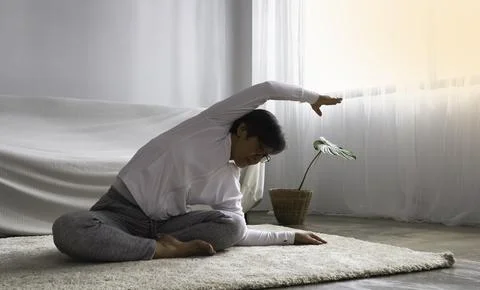 Old lady posing yoga for exercise at living room.for good health 写真素材