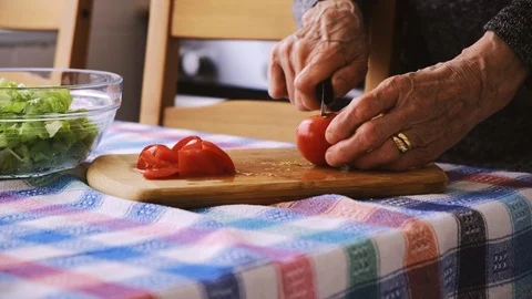 Old lady preparing her salad. Stock Footage 107175045