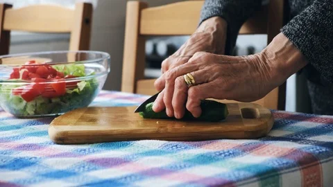 Old lady preparing her salad. Stock Footage 107175216