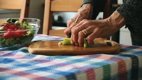 Old lady preparing her salad. Stock Footage 107175225
