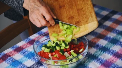 Old lady preparing her salad. Stock Footage 107175742