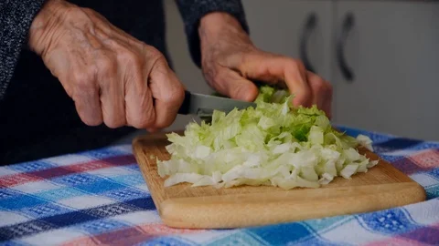 Old lady preparing salad Stock Footage 107162332