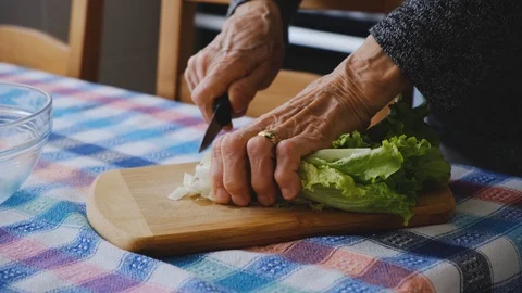 Old lady preparing salad Stock Footage 107162539
