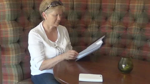 Old lady reading the menu Stock Footage 95298526