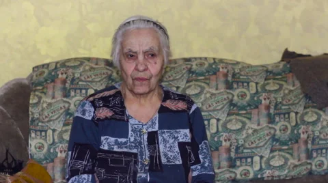 Old lady on the sofa Stock Footage 60235047