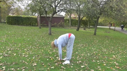 An old lady stretching Stock Footage 86895979