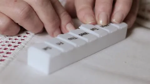 Old lady taking pills Stock Footage 12661367