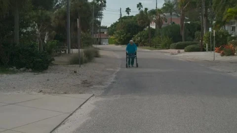 Old lady walking down street - SLOW MOTION Stock Footage 146238521
