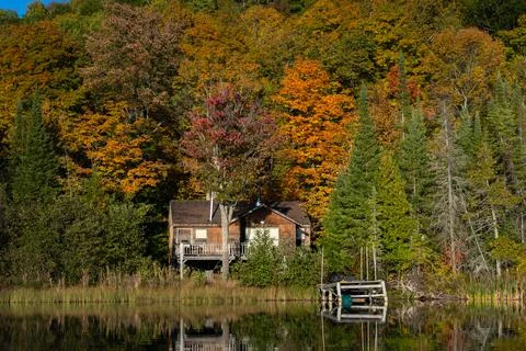 Old lake front cottage Stock Photos