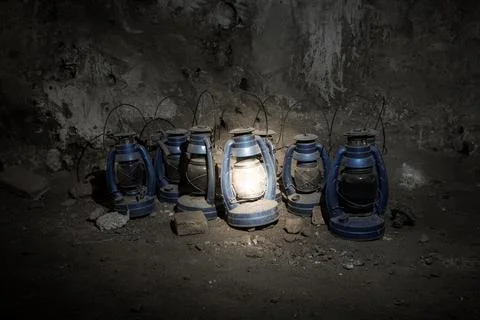 Old lamp in the cave The only light emitting. Stock Photos