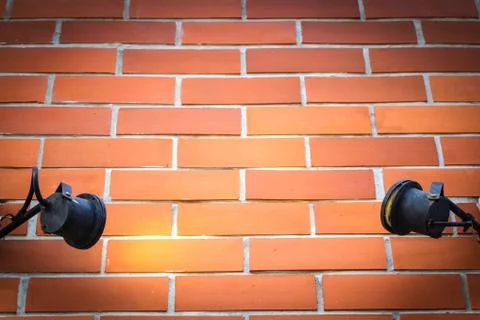 Old lamp lighting wall texture with space for some text Stock Photos