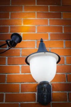 Old lamp lighting wall texture with space for some text Stock Photos