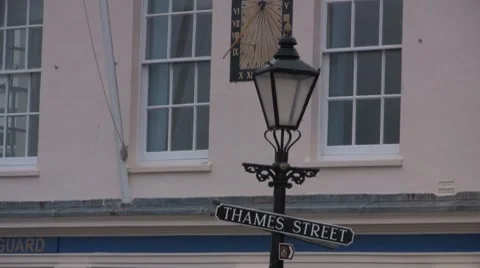Old lamp post and street sign - Thames Street in the rain HD Stock Footage 7628476