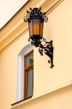 Old lamp with windows on wall Stock Photos