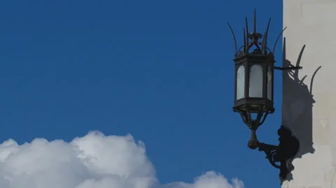 Old lantern and racing clouds (time lapse) Video stock 30552170