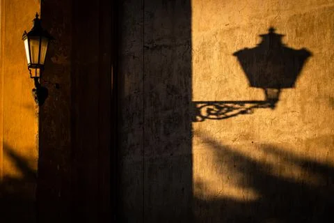 Old lantern in warm evening light in an old downtown street 写真素材