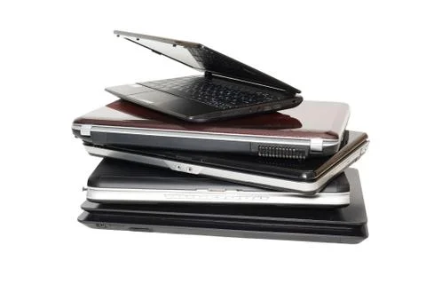 Old Laptops. A stack of old laptops on a white background. Stock Photos