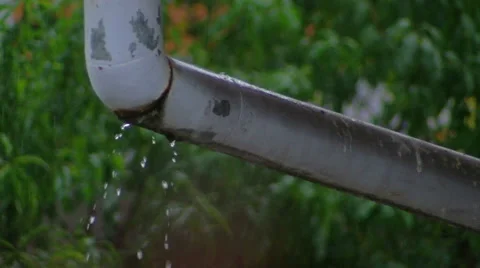 Old leaky gutter on heavy rain Stock Footage 56379070
