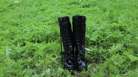 Old leather black high punk women's boots  Stock-Footage 110776718