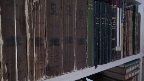Old library full of old and precious books, shelves full of volumes Stock Footage 120032426