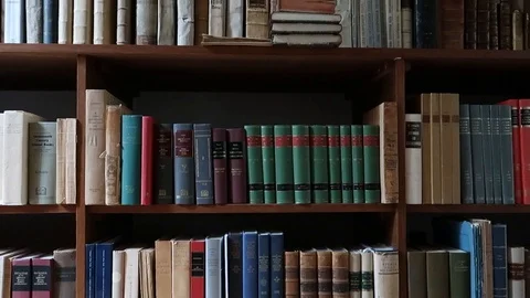 Old library full of old and precious books, shelves full of volumes Stock Footage 120036973