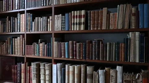 Old library full of old and precious books, shelves full of volumes Stock Footage 120037170
