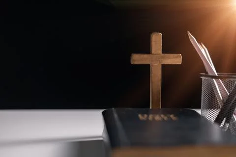 Old library, an open Bible lay on the table, its holy pages of scripture il.. Stock Photos