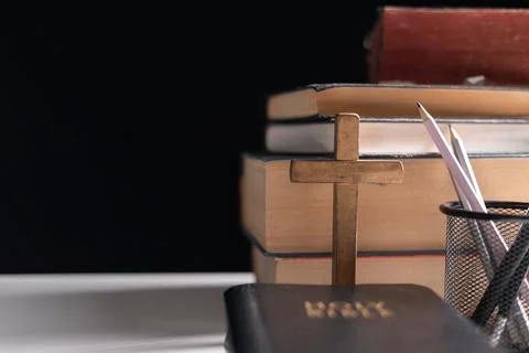 Old library, an open Bible lay on the table, its holy pages of scripture il.. Stock Photos