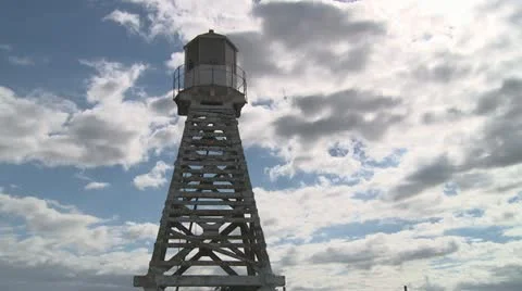 Old light beacon and clouds timelapse Stock Footage 22338702