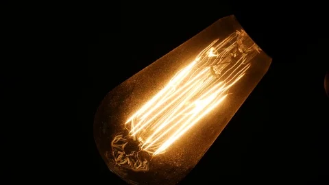 Old Light Bulb Close Up Turn On and Off Video stock 96847975