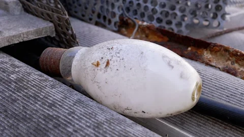 Old Light Bulb on Rusty Metal Video stock 293194567