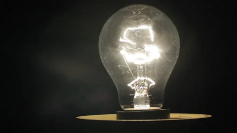 Old light bulb screwed into its nest Stock Footage 233447805