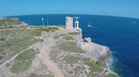 Old Lighthouse on the Cliff - Aerial Flight Stock Footage 50430618