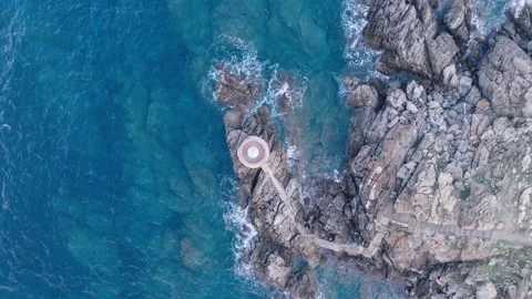 Old lighthouse on a cliff at sunset Stock Footage 230985592