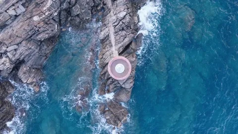 Old lighthouse on a cliff at sunset Stock Footage 230995134