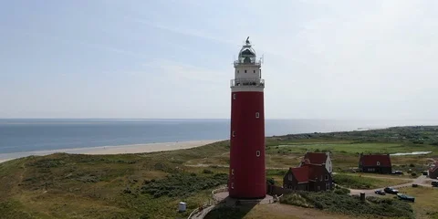 Old lighthouse on the coast of Texel Island Stock Footage
