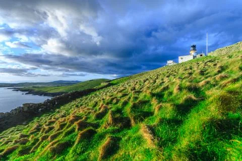 Old lighthouse on isolated island Stock Photos