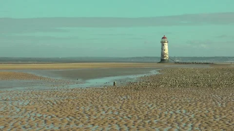 Old lighthouse at low tide wintry sky.mp4 Stock Footage 47097076