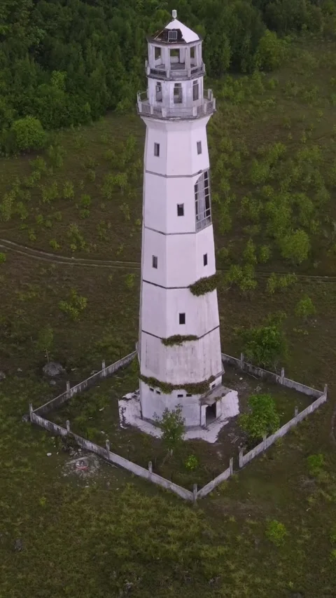 Old lighthouse at ocean coastline. vertical video Stock Footage 295743800